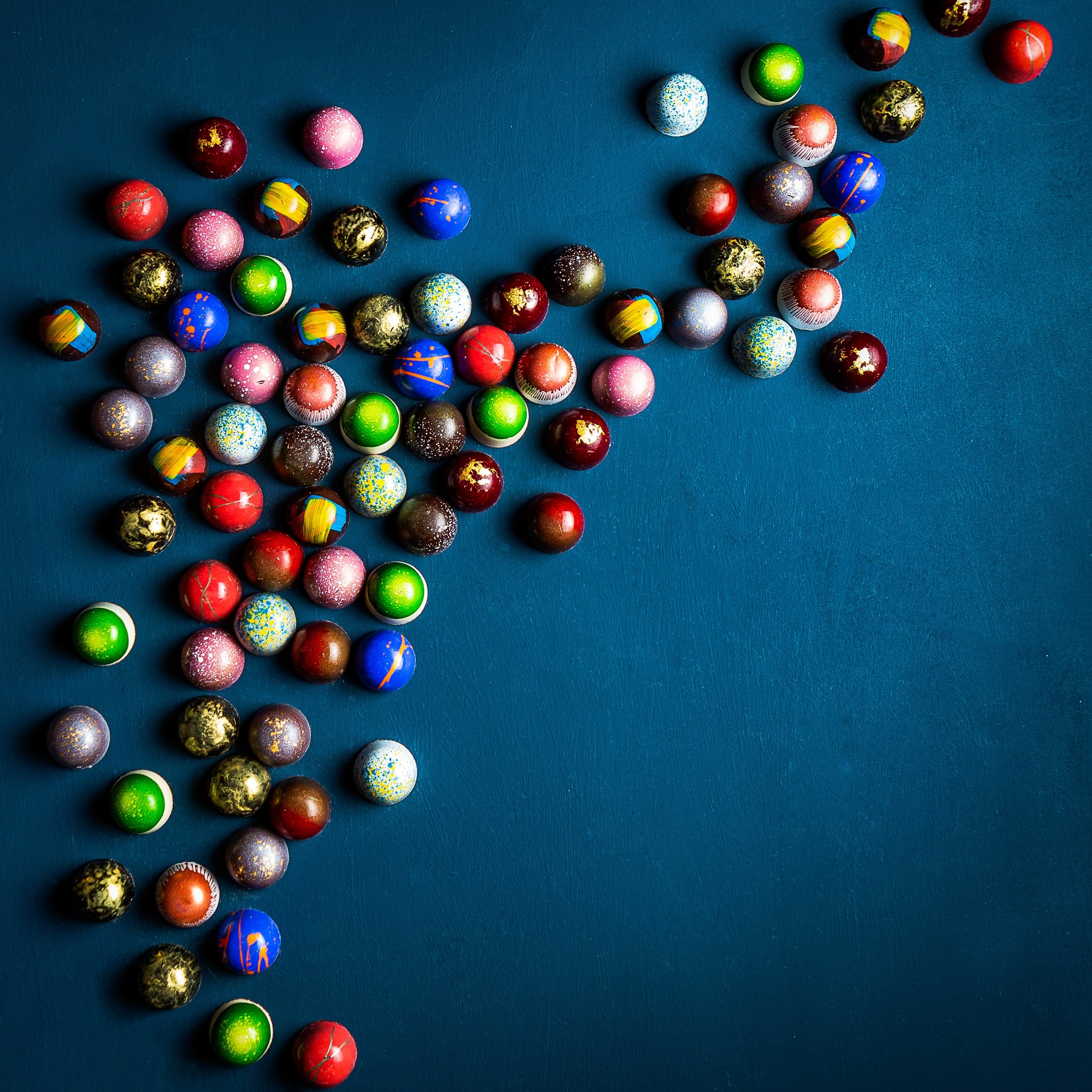 Decadent collection of vibrant, hand-painted chocolates by XO Chocolate London