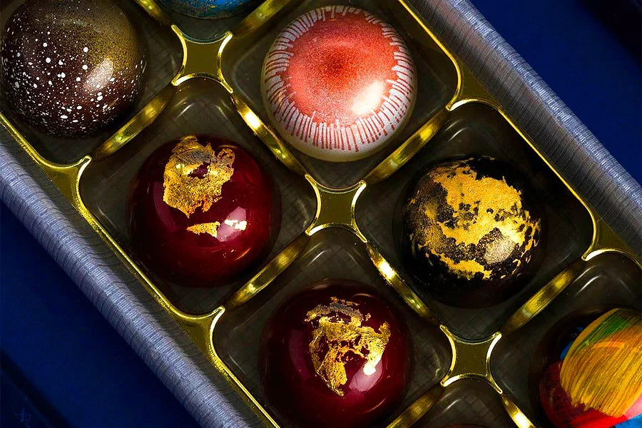 Selection of luxury chocolates in gold, red and black