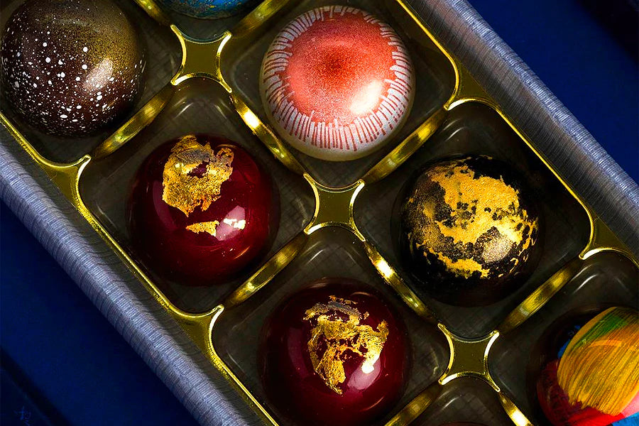 Selection of luxury chocolates in gold, red and black