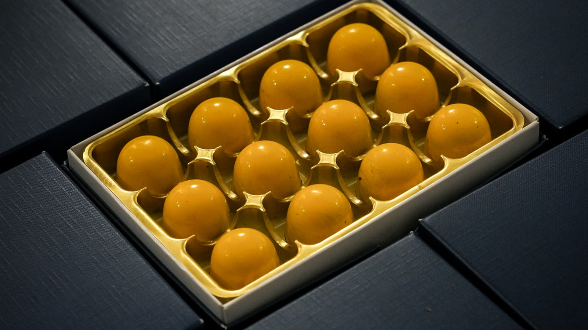 12 Lemon Cheesecake bonbons with baked lemon cheesecake flavour and New York style base by XO Chocolate London