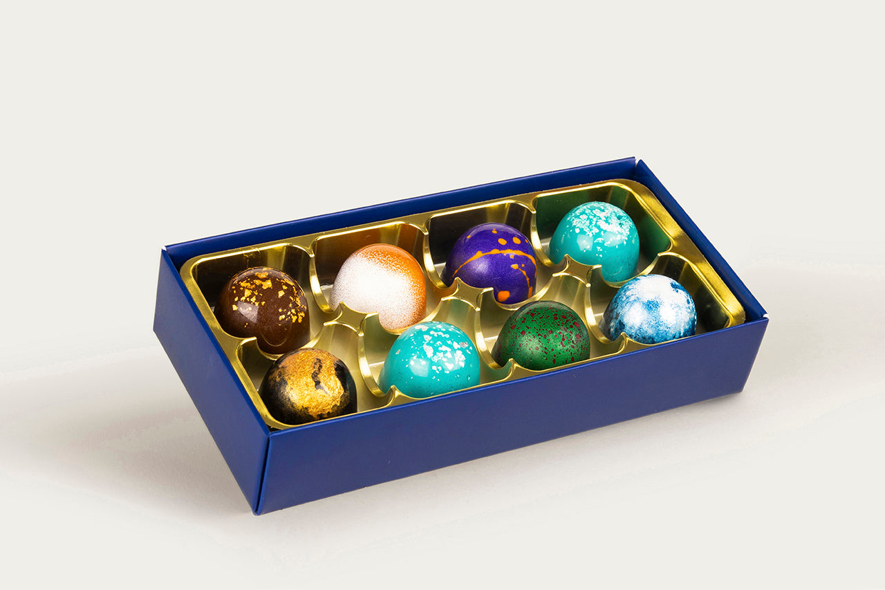 Luxurious 8-piece box featuring an array of colorful, artisanal chocolates from XO Chocolate.