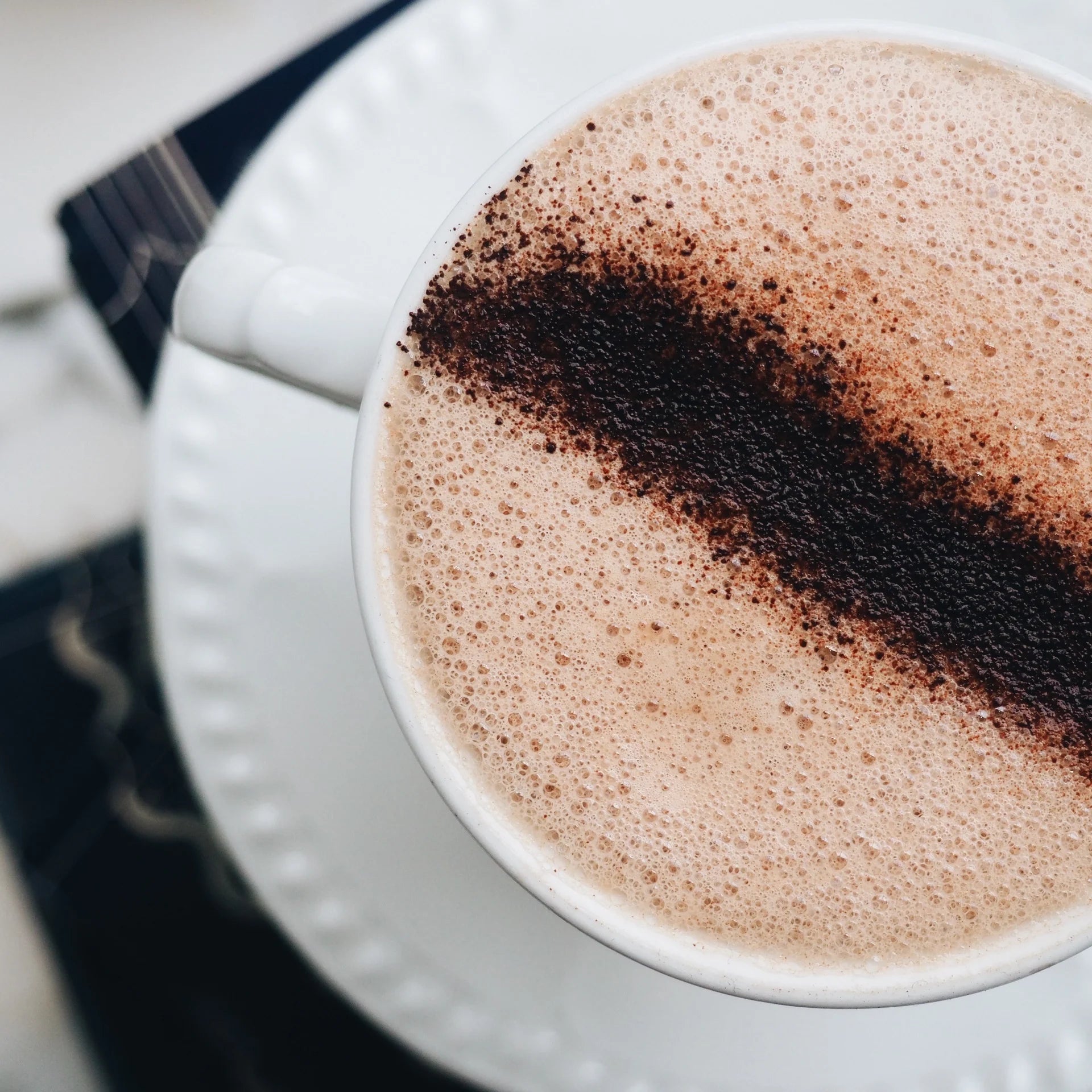 decadent hot chocolate with delicious foam, served in china cup by XO Chocolate London