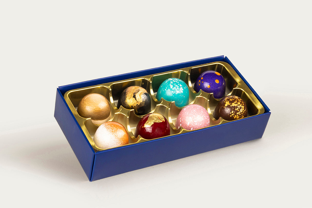 Exquisite 8-piece collection of vibrant, hand-painted chocolates by XO Chocolate.