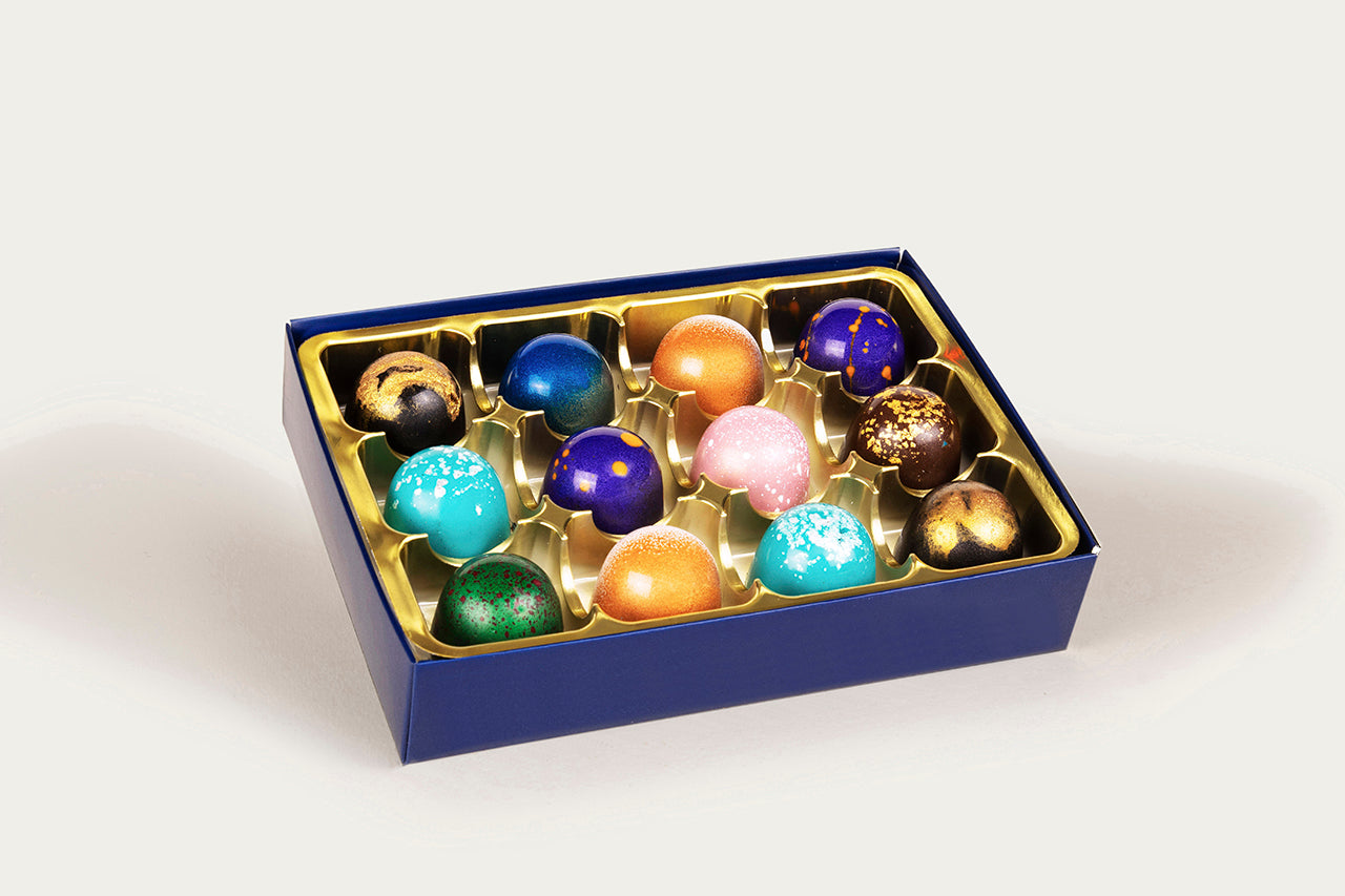 Luxurious gift idea: 12-piece box of artisanal colorful chocolates by XO Chocolate.